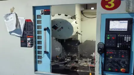 CNC machine interior and control panel in the MIGE workshop