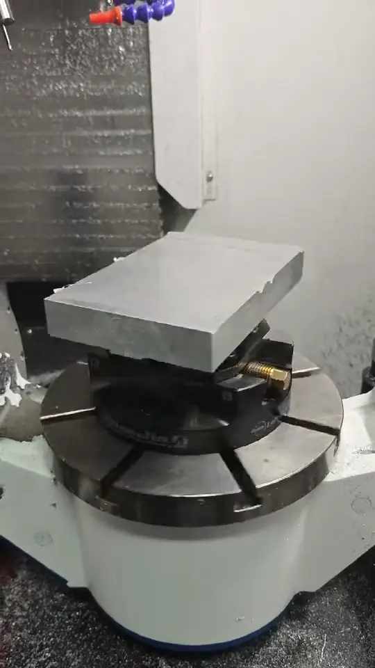 Aluminum billet secured on a rotary machining fixture