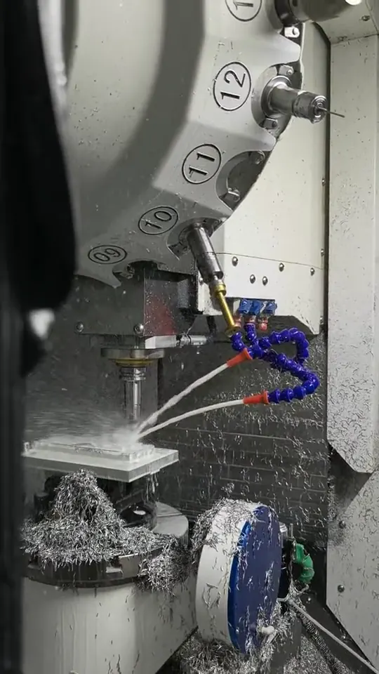 CNC cutting an aluminum component inside a machining center