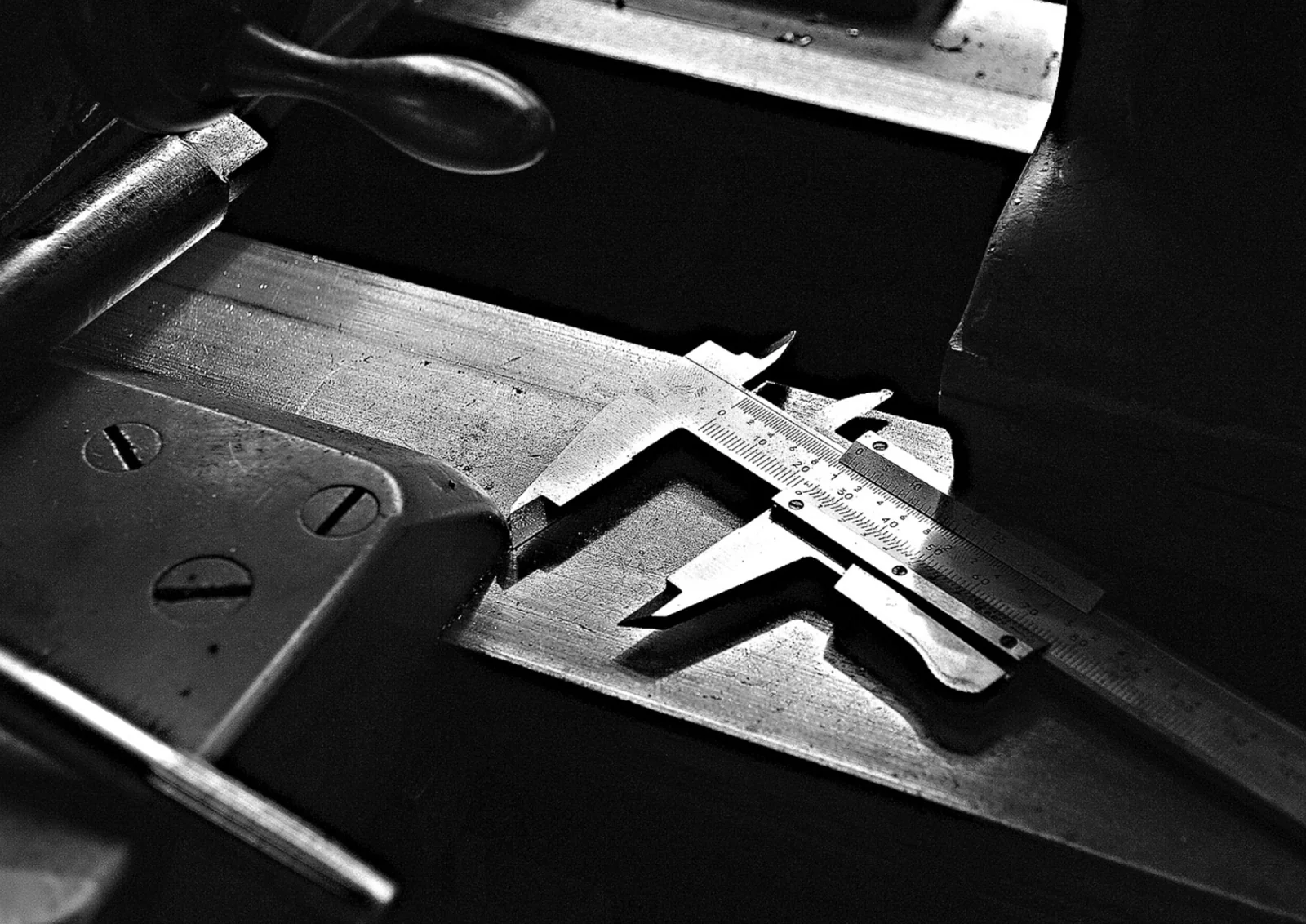 Vernier caliper on a machined metal surface